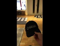 Man Hits Lady on Head with Cap Throw