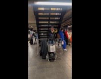 Collab Subway Creatures - Man play trombone then sing under stairs