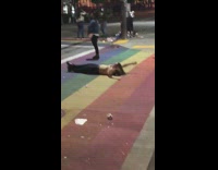 Woman lie down PRIDE pedestrian lane photo shoot