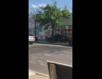 Man parked car at the sidewalk policeman graffiti wall