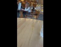 Woman in white jacket selfie at inside the restaurant