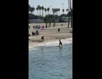 Man shirtless dramatic dance beach seaside waves