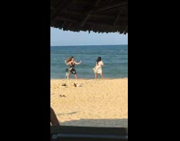 Two girls dress dance beach tripod string