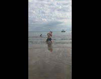 Woman bikini pictorial man mock pose beach