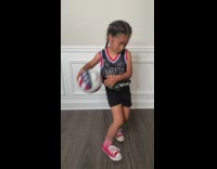 Little girl does basketball tricks 