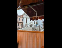 Woman tube top dances by the stairs