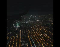 Filmer inside airplane view of manila city in the air