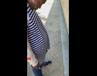 Woman with powder on cheek offers wall fire hydrant a cigarette