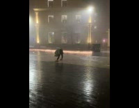 Girl bend forward look between legs street