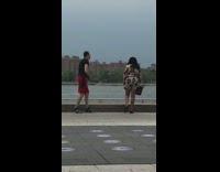 Guy does handstand with arms bent near water 