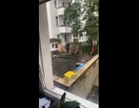 Guy stands picnic table chair black boots