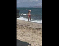 Woman bikini hand on forehead selfie beach