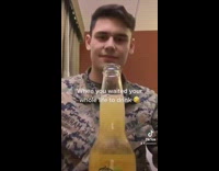 Guy in army uniform spits out his first beer