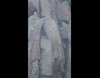 Man white shirt lie down photo shoot top of waterfalls
