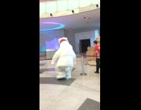White polar bear chasing woman 