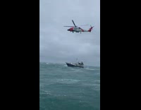 4 boats in the Atlantic Ocean with a helicopter 