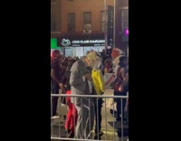 Guy wears Trump and Kamala face mask 