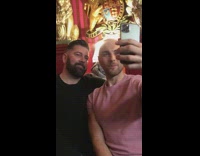 Two guys selfie sitting down laugh