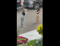 Two girls take turns with sunglasses street
