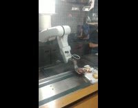 Robot arm prepares burger patties and fails