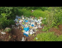 Green grass mountain view trash litter
