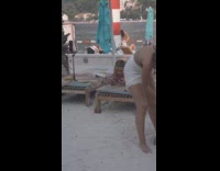 Collab IITW - Woman bikini poses and looks at filmer at beach