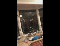 A girl grabs a cookie throws it at window