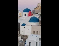 Girl wears ballgown on rooftop 