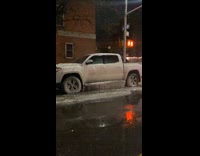 Frozen icicles on a parked truck