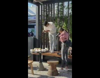 Man stands bench food shot caught