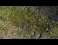 Man lie down inside the volcanic crater