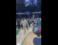 Man Shoots Ball into Ring at Stadium