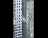 Water bursts out from the building window