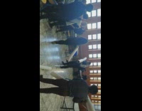 Friends hit each other rolled up posters