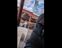 Collab IITW - Woman films woman walk at food court