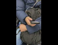 Man with wedding ring swiping on dating app