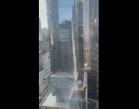 Dirty water falls from skyscraper window