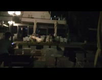 four guys jousting large white umbrellas