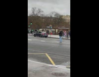 Woman poses in front of the Eiffel Tower 