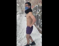 Shirtless guy falls forward onto snow 