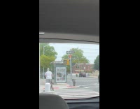 Dad push stroller wears rollerblades crossing street