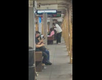 Guy gives haircut in subway station on bench
