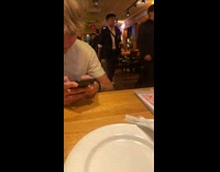 Collab BitchMP - Person dressed as batman walks through restaurant a