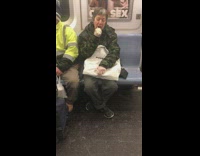 Woman brushes her teeth on subway