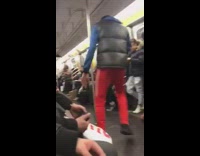 Red Pants Guy Dances to Music Inside Subway Car