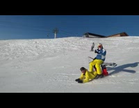 Skiier and snowboarder go down slope together 
Part 2 