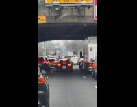 Truck blows plumes of smoke at highway