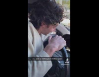 Guy picks off ticket from windshield of car