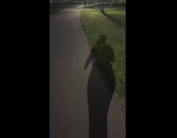 Woman on walk saw people juggle light sticks