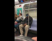 Guy wear marquee hat that says you dont have ADHD on subway train